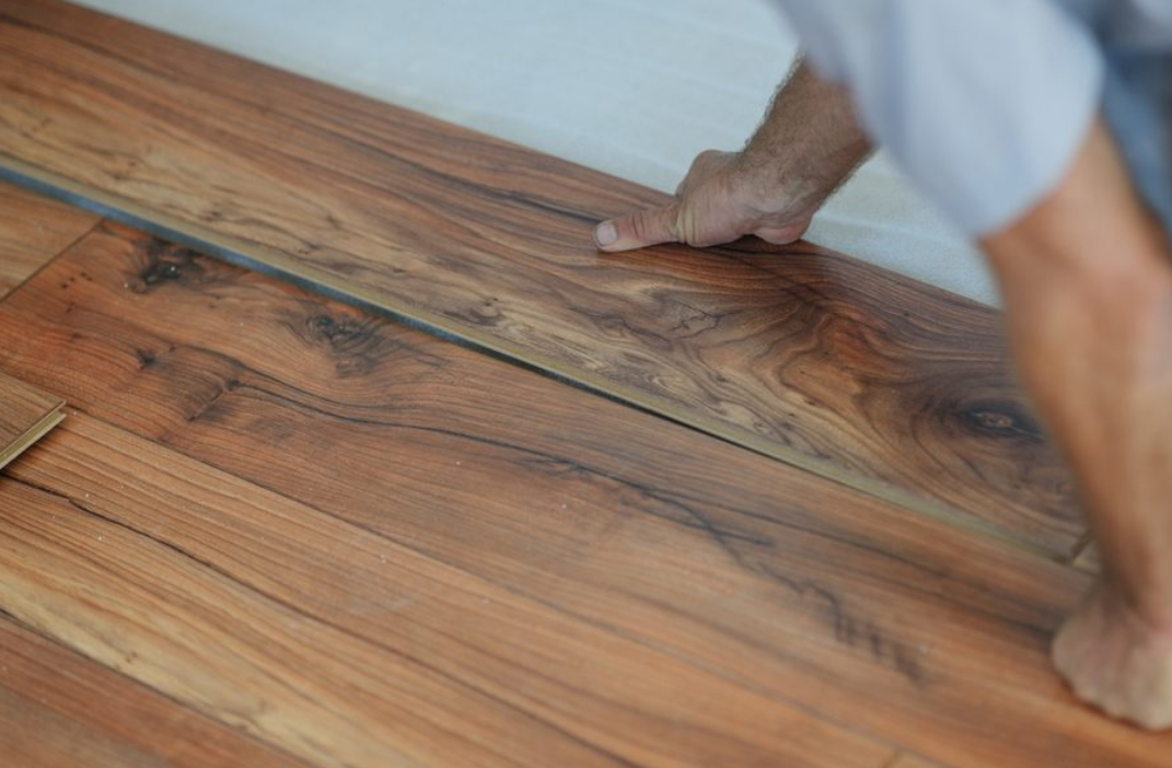 Laminate flooring installed in an Ottawa home featuring realistic wood-look planks designed for durability, affordability, and everyday wear.